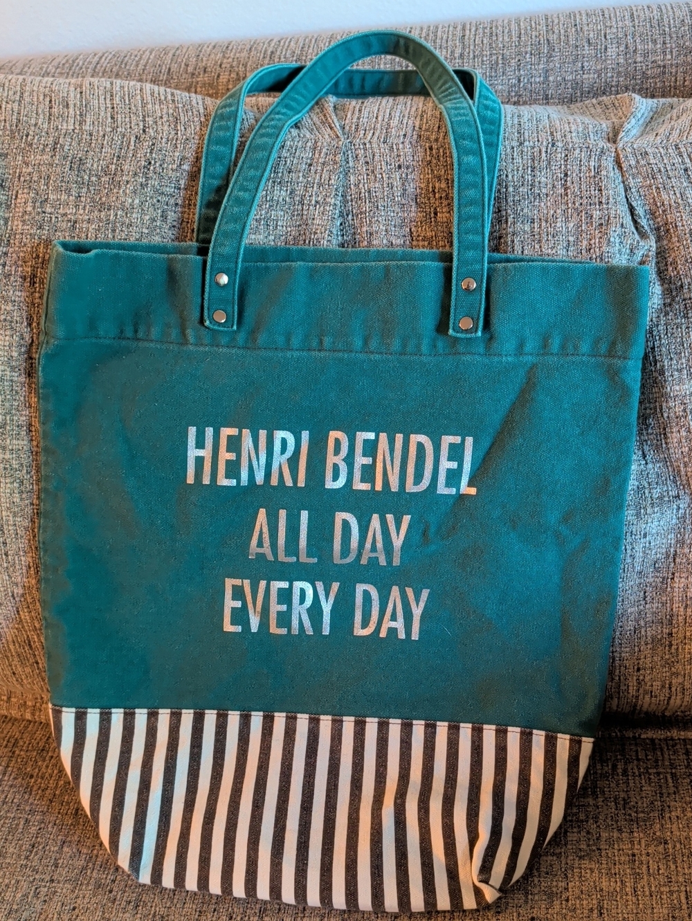 Henri Bendel teal canvas tote with black and white striped bottom